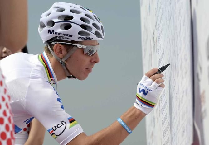 World champion Rui Costa (Movistar) signs on ahead of stage one of the Tour of Beijing.