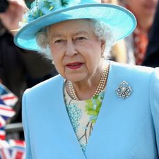Crowds cheer as Queen Elizabeth II arrives in Valentine's Park Redbridge as part of her Diamond Jubilee tour of the UK on March 29, 2012