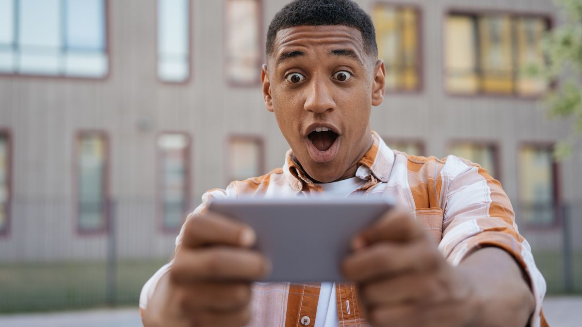 Guy in plaid shirt holding a phone