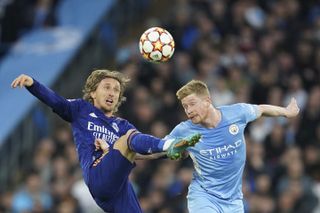 Kevin De Bruyne (right) and Luka Modric in action