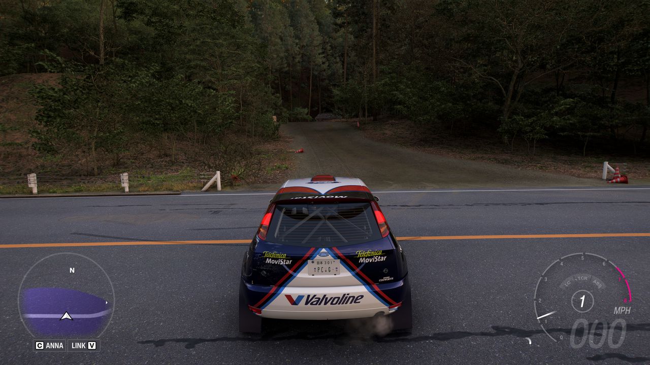 Forza Horizon 6 Barn Finds: A player parked by a dirt road leading to an old wooden barn.