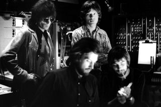 Keith Richards and Mick Jagger (back, left to right) of the Rolling Stones along with producers Jimmy Miller and Glyn Johns (foreground, left to right) in the studio