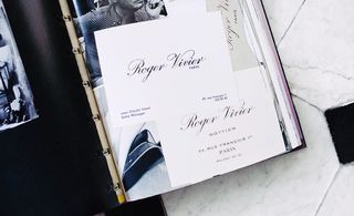 The book features advertising, business cards and show invitations