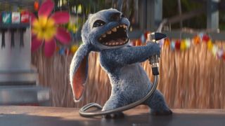 Stitch spraying water while smiling in Lilo & Stitch