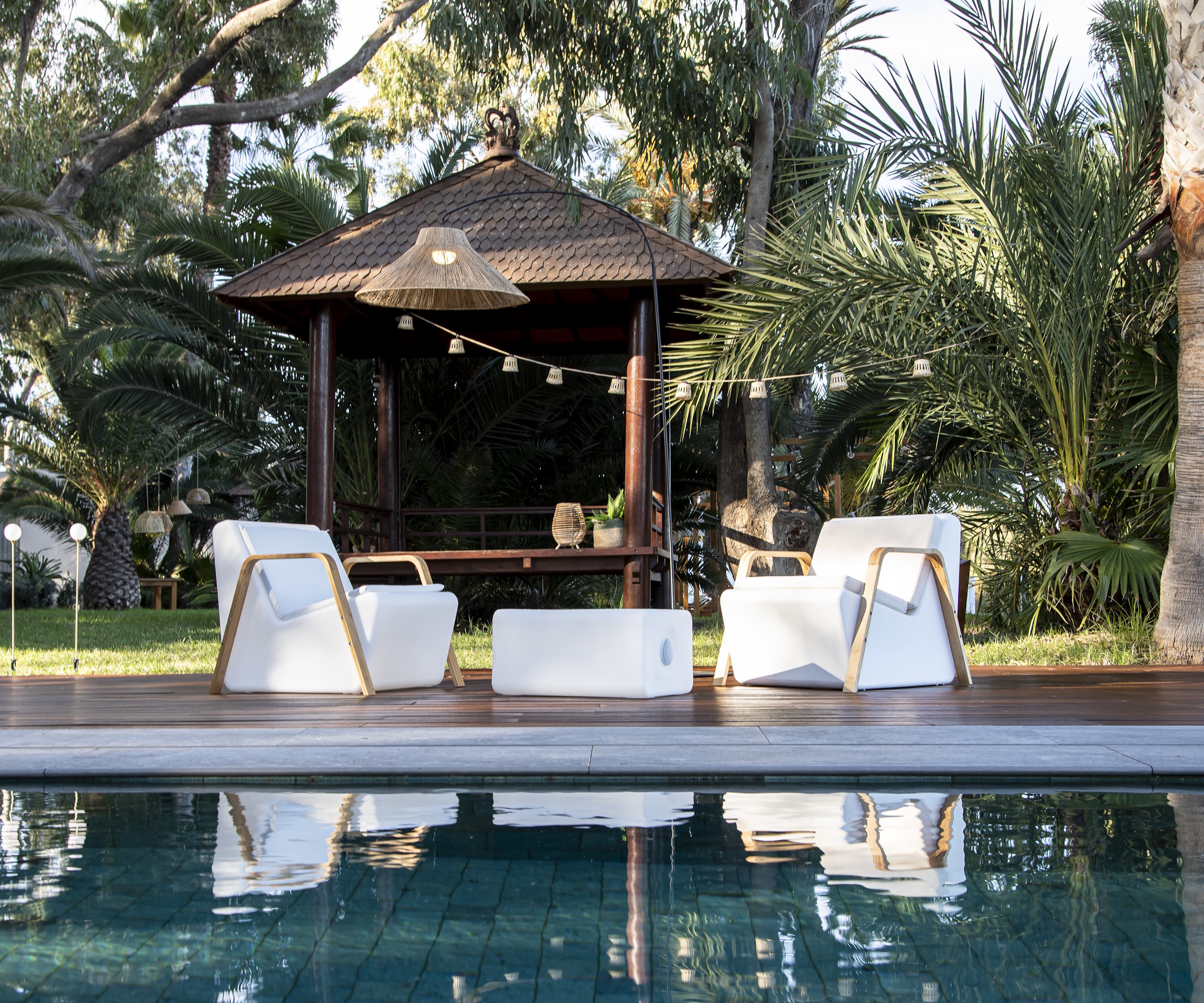 Newgarden TARIDA patio furniture by a pool in summer