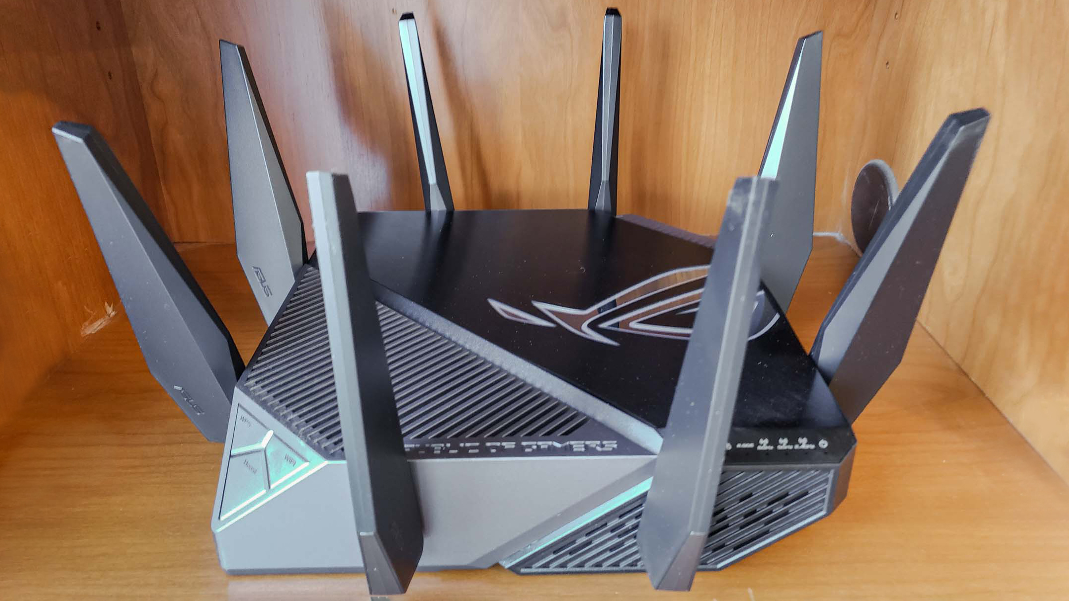 Asus GT-AXE11000 router on shelf
