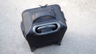 Tenba Roadie Air Case Roller 21 camera bag on a stone flag floor