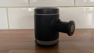 The side view of the Wacaco Picopresso on a kitchen countertop