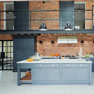shaker kitchen with exposed brick and black steel