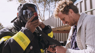 Still from Speed of Thought showing a firefighter with an AR helmet.