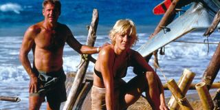 Six Days Seven Nights Harrison Ford and Anne Heche stand amid their beach camp