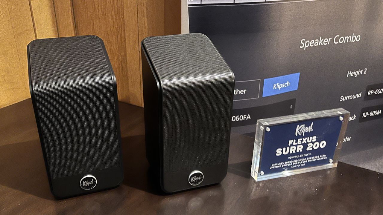 Klipsch SURR 200 surround speakers on table at CEDIA Expo