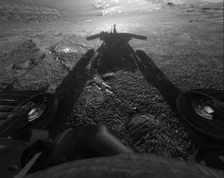 NASA's Mars rover Opportunity reveals its shadow, seen on July 26, 2004, and snapped by the rover’s front hazard-avoidance camera. At the time, Opportunity was moving farther into Endurance Crater in the Meridiani Planum region of Mars.