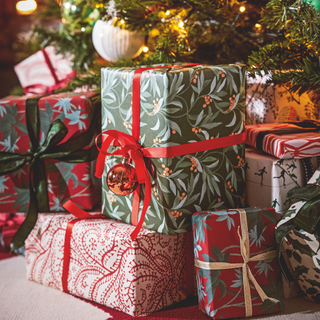 Gift wrapped presents with wrapping paper and ribbons.