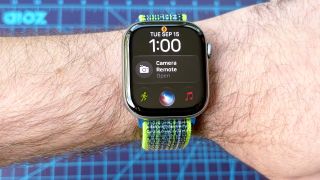 Close-up of the Siri AI setup process using an Apple Watch 11 and iPhone 16 Plus