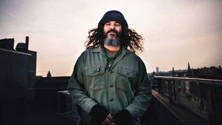Brant Bjork wearing a woolly hat and warm jacket
