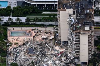 This aerial view of the partially collapsed Champlain Towers South, north of Miami Beach, shows search-and-rescue personnel at the site.