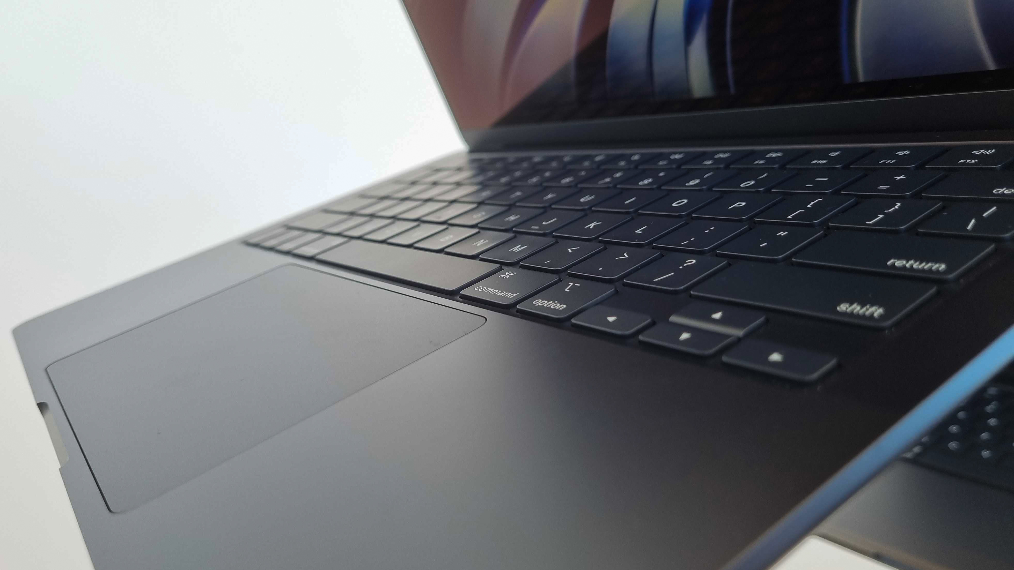 The Apple MacBook Air 2022 laptop on a stand