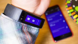 The Microsoft Band being paired to an iPhone