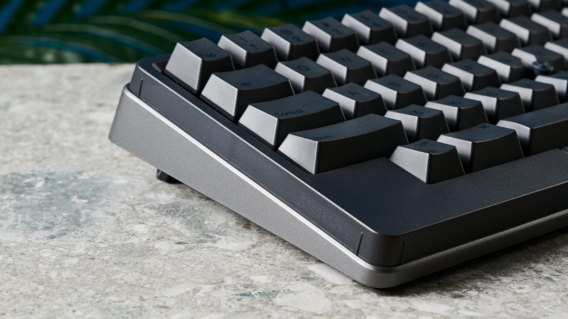 A photo of the HHKB Studio mechanical keyboard on a stone surface