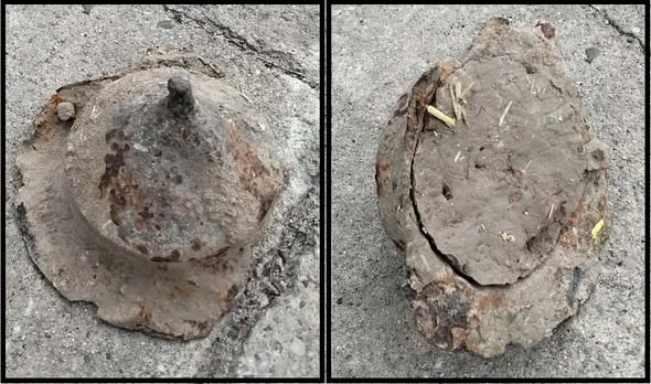 A cone-shaped stone container is against a stone surface.