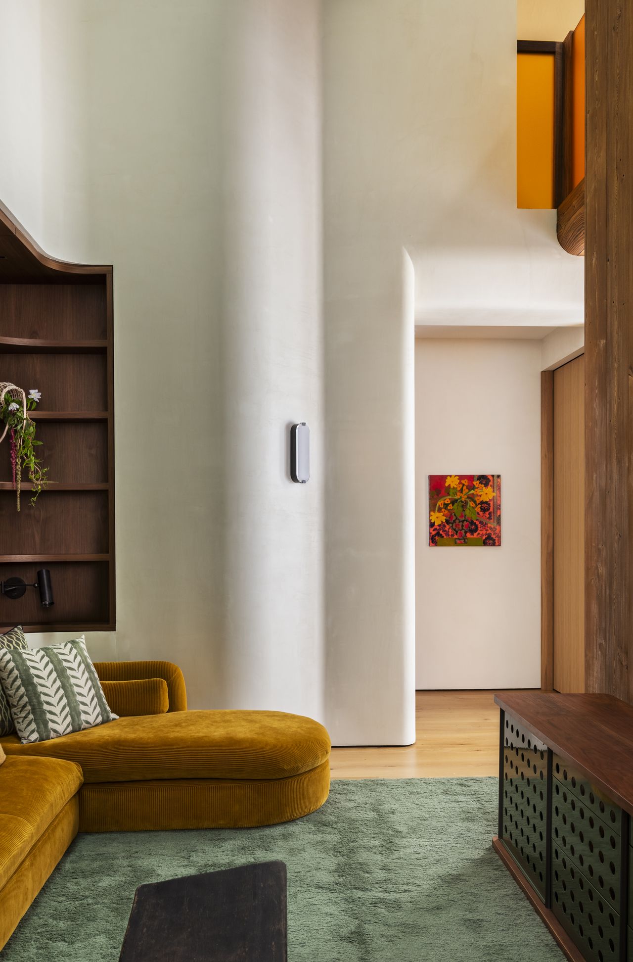 A soaring living room with gentle cruved walls