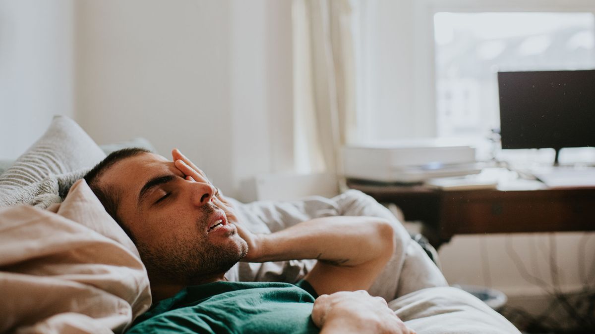 man waking up from sleep