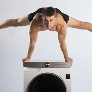 Olympic Gold Medallist Max Whitlock doing a handstand on top of a Samsung ecobubble washing machine