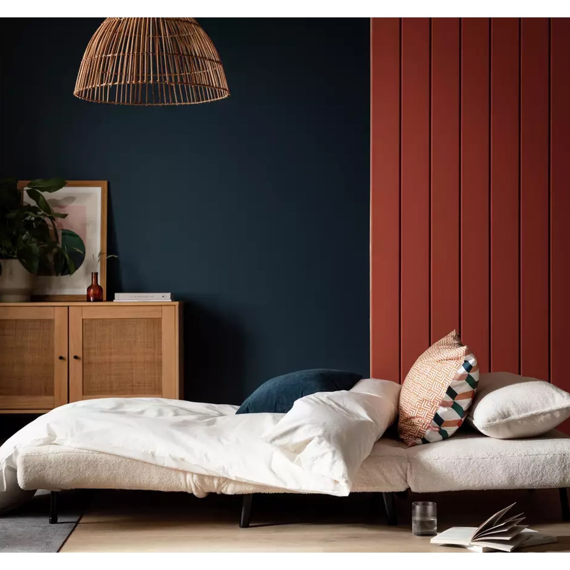 A white boucle sofa bed