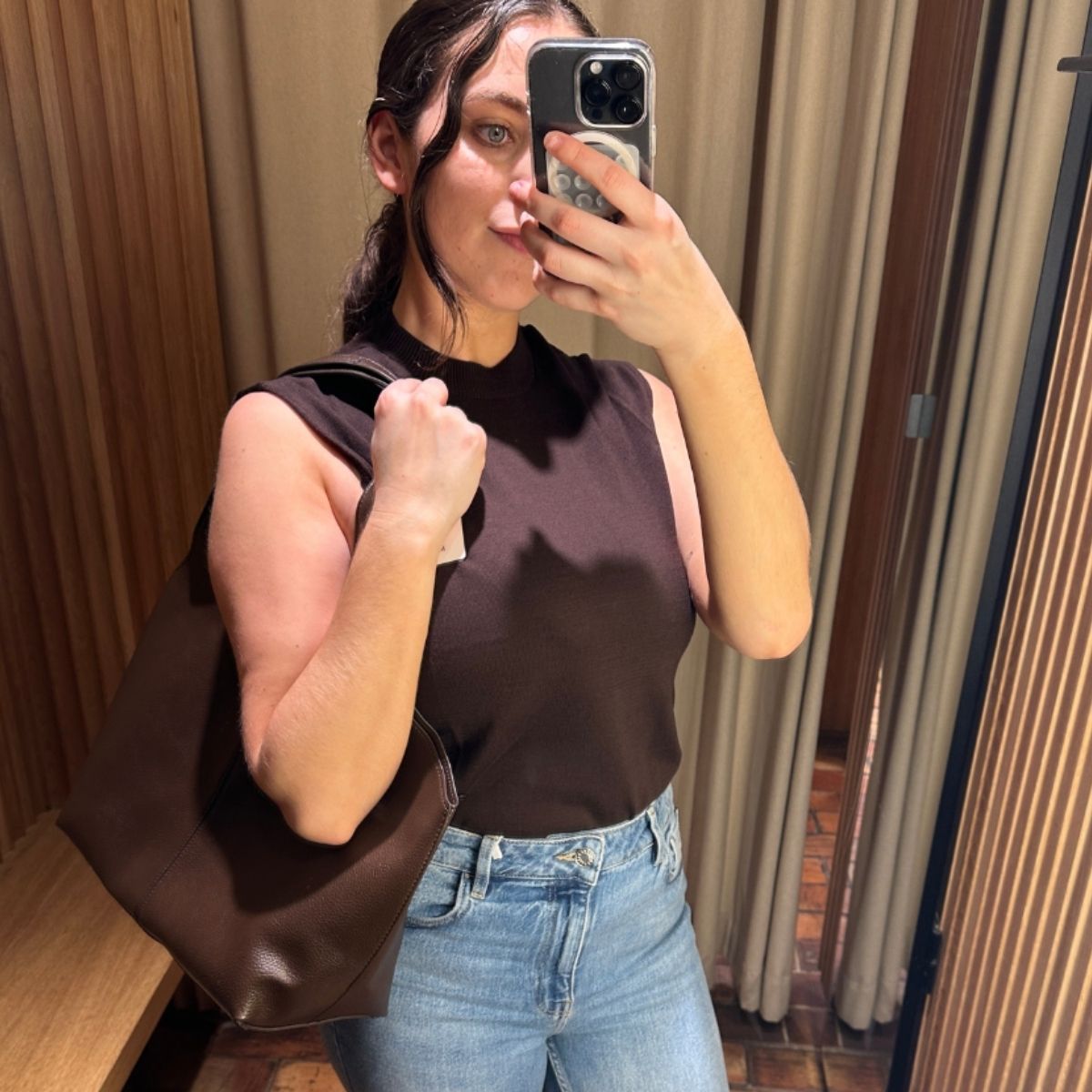 An image ofBest Knockoff Luxury Clothing
 UK SEO Writer Ava Gilchrist wearing a pair of bootcut jeans. 