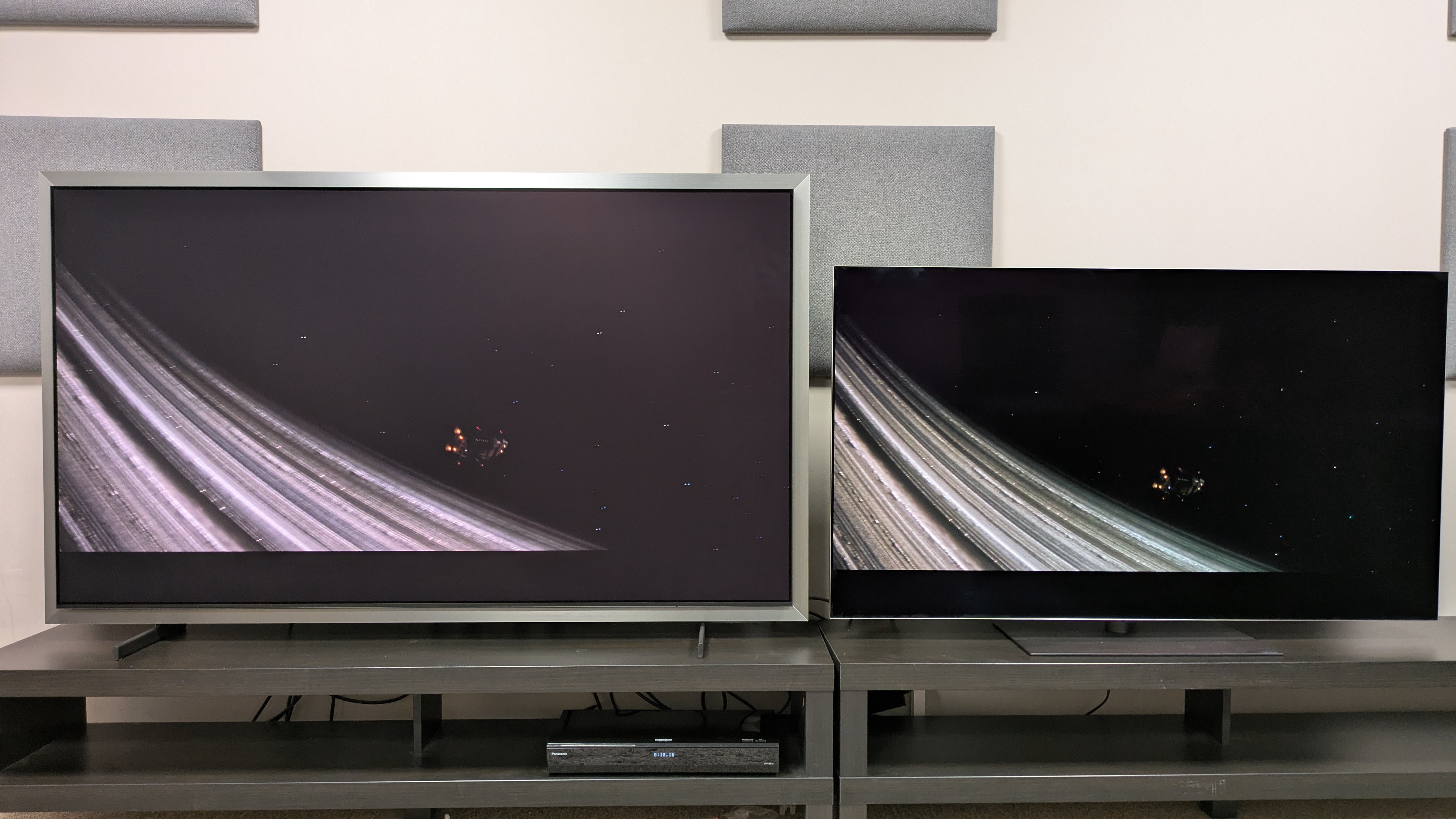 Samsung S99H vs LG G6 both set to Filmmaker Mode showing a scene from space from Alien Romulus. Both TVs show great contrast, but the G6 shows more detail