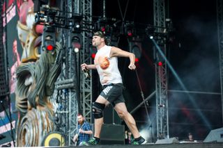 Adam Dutkiewicz of Killswitch Engage taking it to the people at Download Festival, 2014