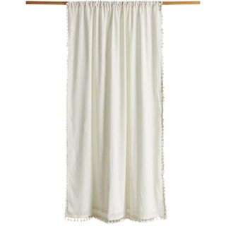 Urban Outfitters Palma Fringe Light Blocking Window Curtain on wooden rod in cream