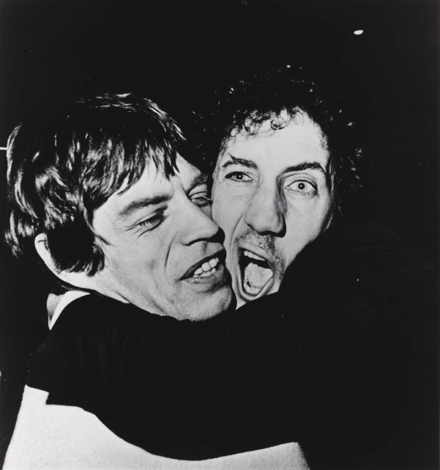 Mick Jagger and Pete Townshend hugging