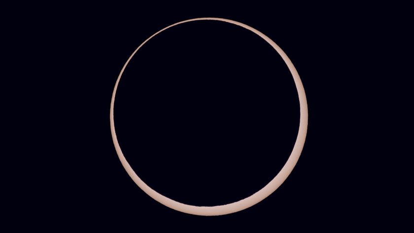 a ring of light around a black orb - this is an annular solar eclipse close up.