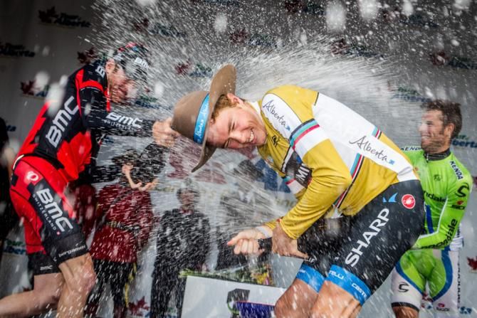 Rohan Dennis (Garmin-Sharp) celebrates with champagne after his big win.