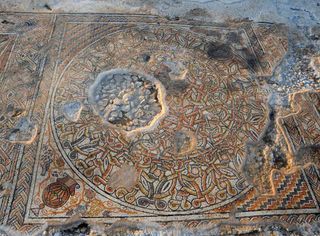 The mosaic discovered prior to construction of an interstate in Israel, was decorated with geometric structures and amphoras, or vessels for holding wine. The amphoras were also decorated, for instance, one was flanked by a pair of peacocks.