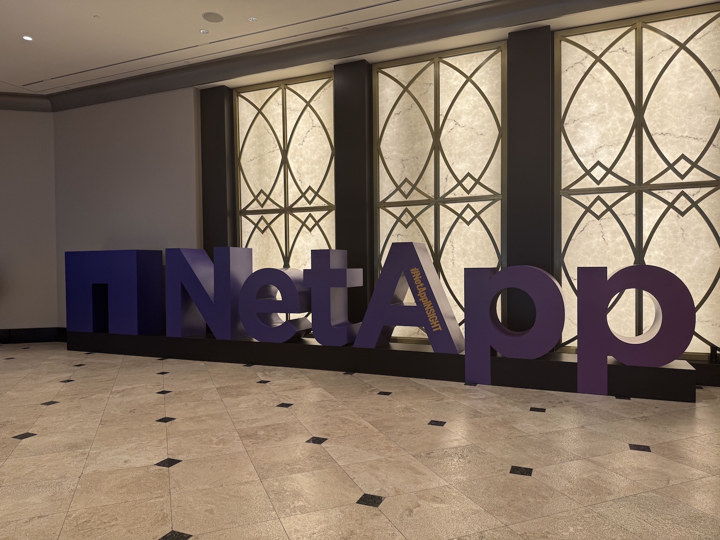 An image of NetApp's purple, freestanding 3D logo as you walk into the conference center