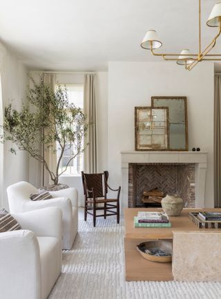 Two antique mirrors above the fireplace in the living room