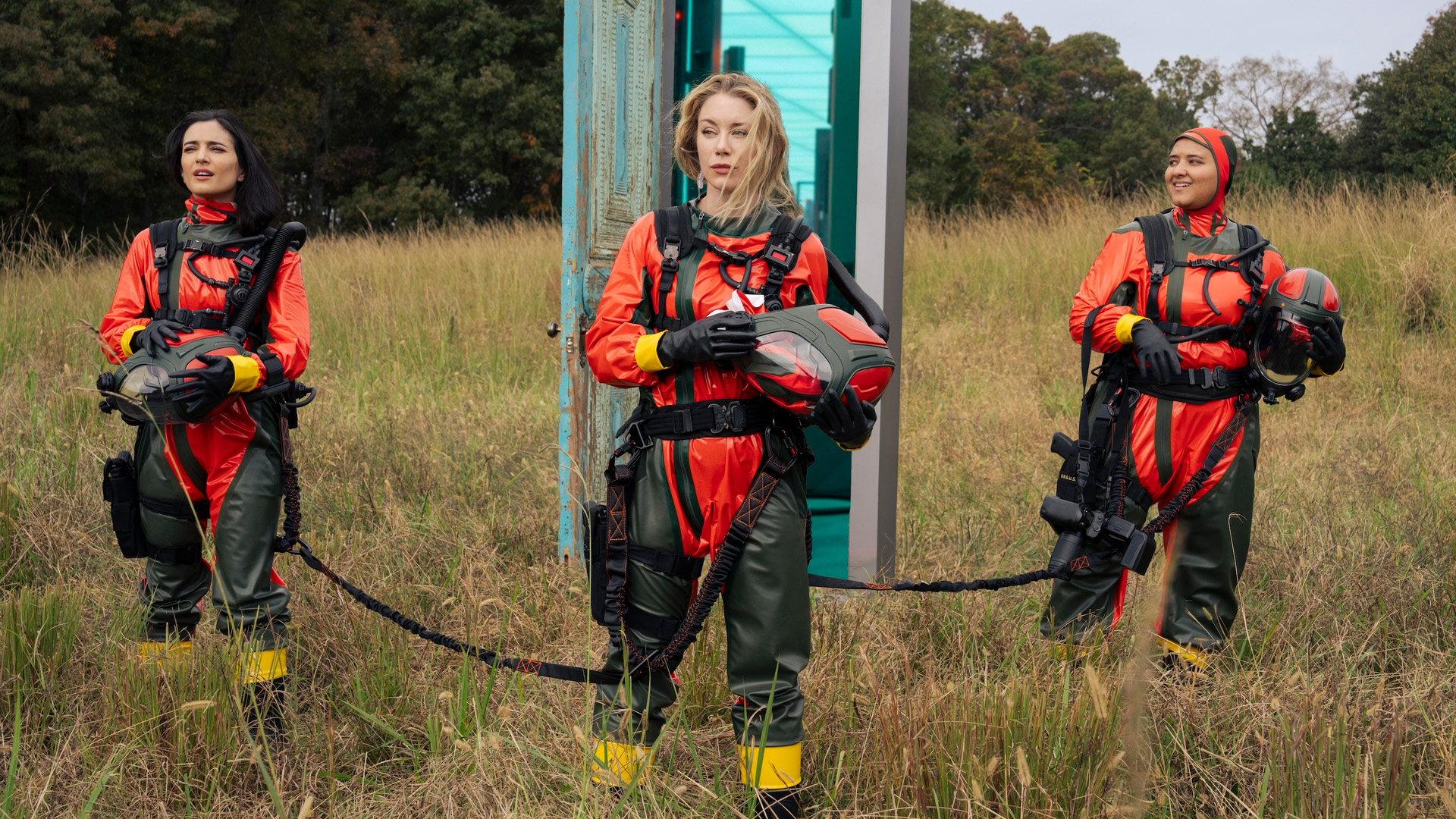 Sol Rodriguez as Sasha Bordeaux, Jennifer Holland as Harcourt, and Anissa Matlock as Angler in Peacemaker season 2, standing on the surface of Salvation.