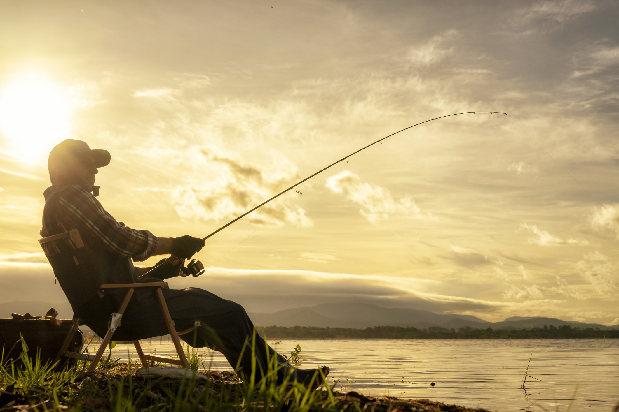 Older man fly fishing