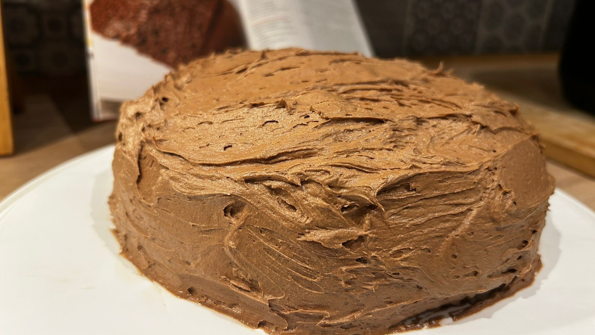 Frosted chocolate cake baked using Cosori 5L Rice Cooker