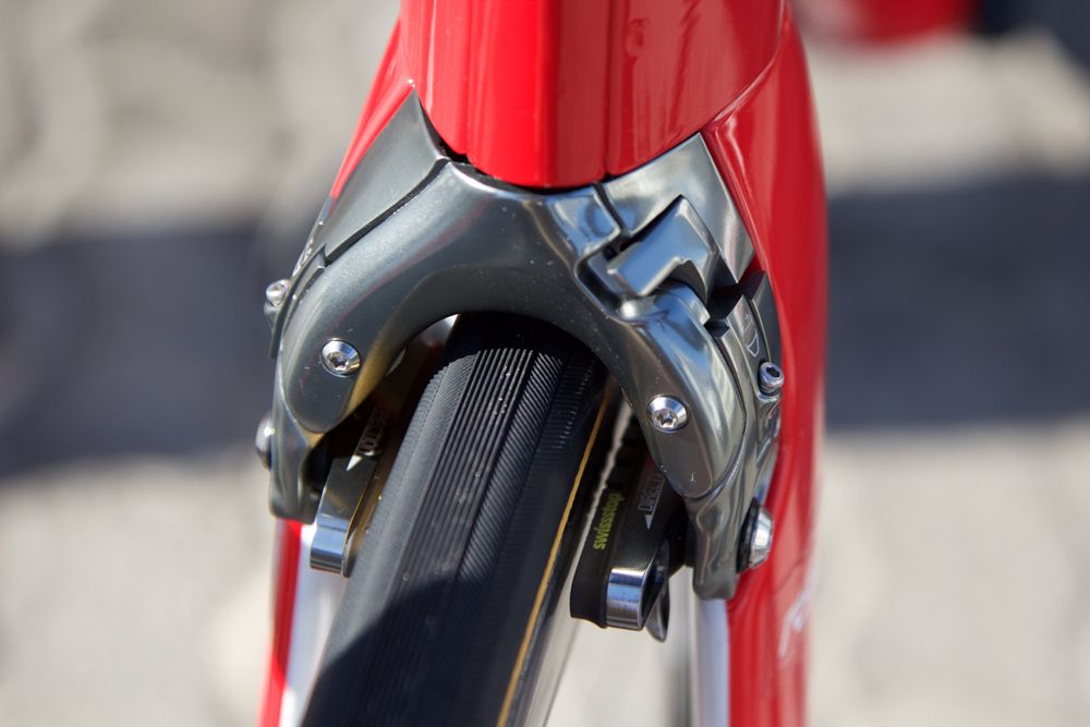 The front brake is tucked up against the frame