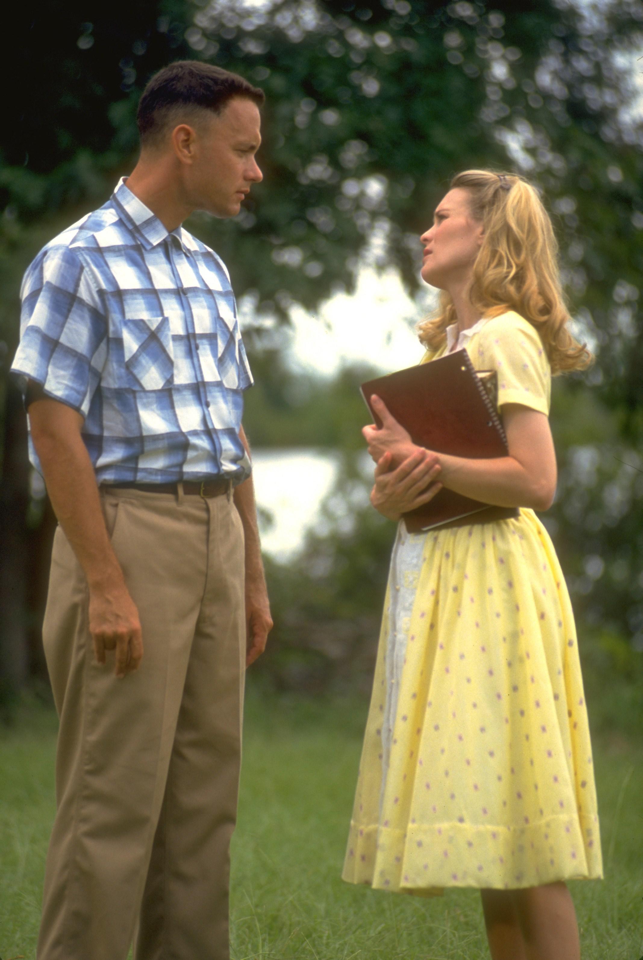 Tom Hanks and Robin Wright star in 'Forrest Gump as forrest and jenny outside in a yard in a still from the movie