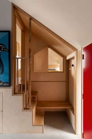 an alcove made in plywood with built in seating