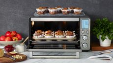 Best toaster ovens - Breville Smart Oven Air Fryer Pro sitting on a counter with fresh muffins