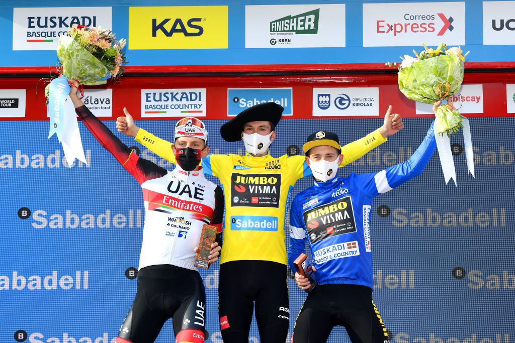 ARRATE EIBAR SPAIN APRIL 10 Podium Tadej Pogacar of Slovenia and UAE Team Emirates Primoz Roglic of Slovenia and Team Jumbo Visma Yellow Leader Jersey Jonas Vingegaard Rasmussen of Denmark and Team Jumbo Visma Blue best young jersey Celebration during the 60th ItzuliaVuelta Ciclista Pais Vasco 2021 Stage 6 a 1119km stage from Ondarroa to Arrate Eibar 535m Mask Covid safety measures Txapela Trophy Trophy Flowers itzulia ehitzulia on April 10 2021 in Arrate Eibar Spain Photo by David RamosGetty Images