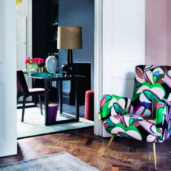 white door in living room designed sofa chair and wooden flooring