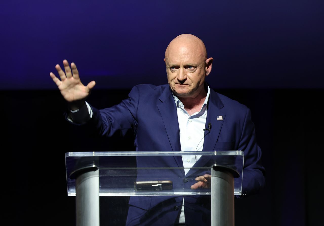 Sen. Mark Kelly (D-Ariz.) holds a speech on Election Night. 