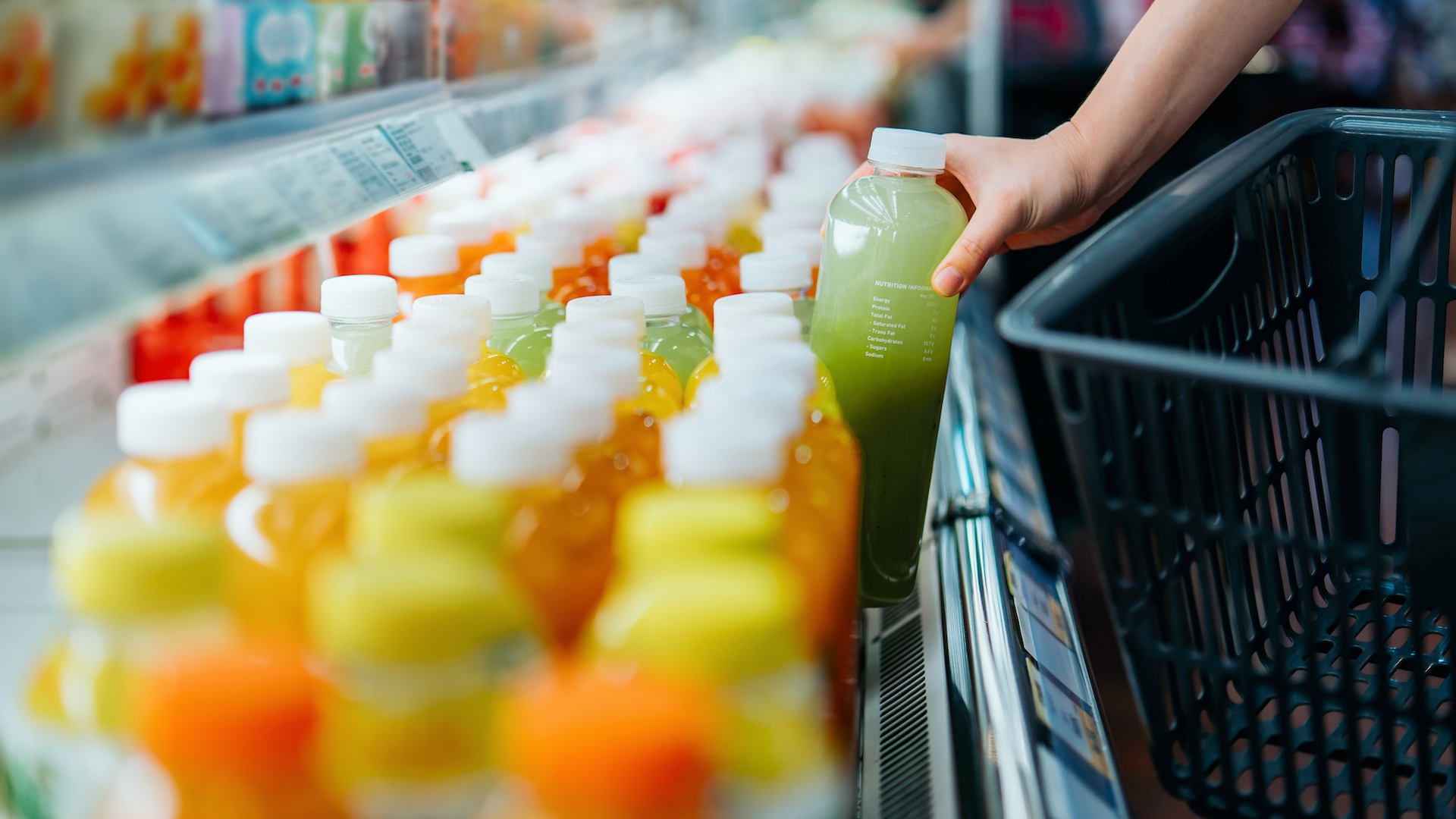 Bottles of juice in fridge